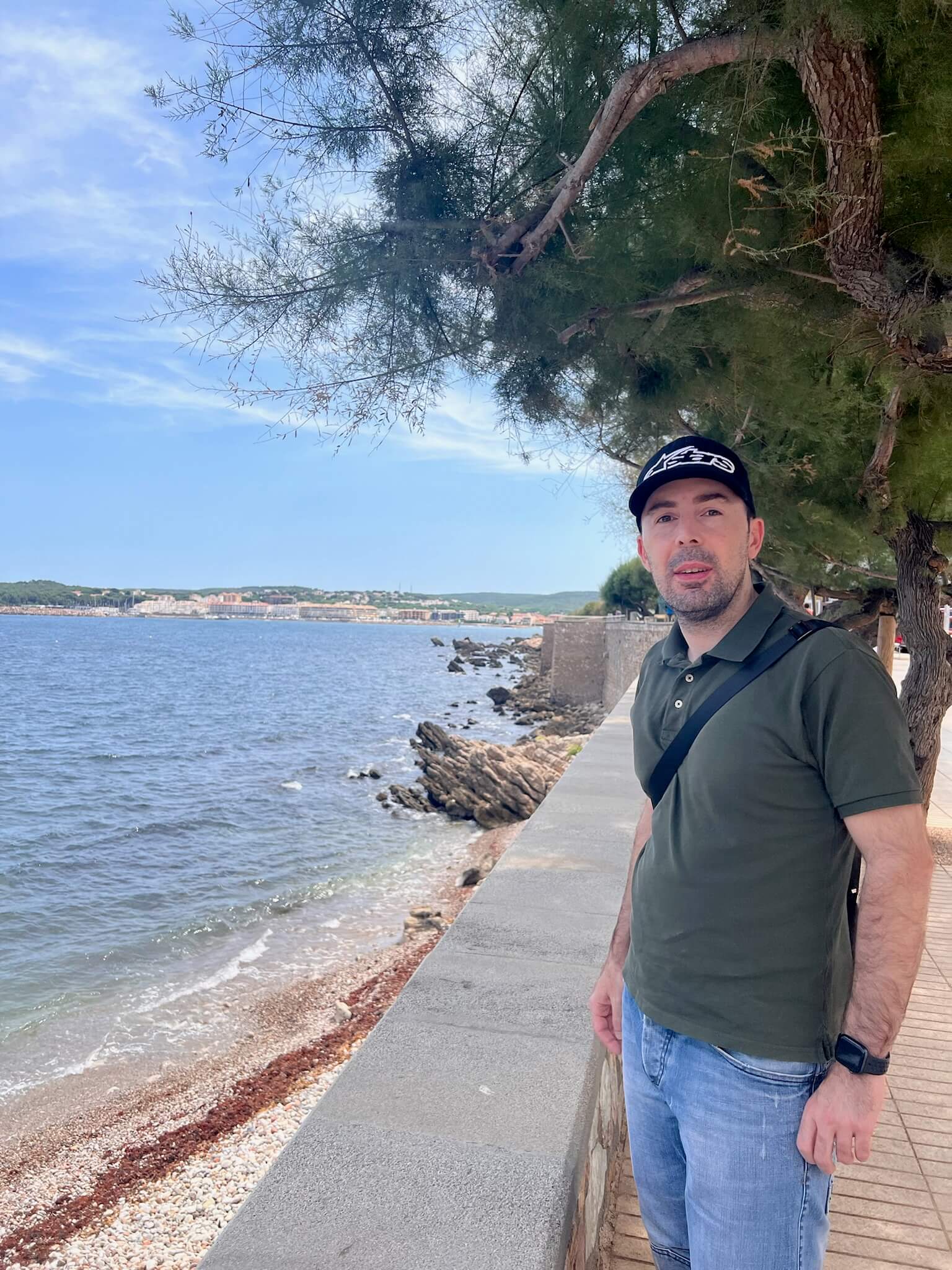 A photo of Carlos on the boardwalk next to L'Escala beach